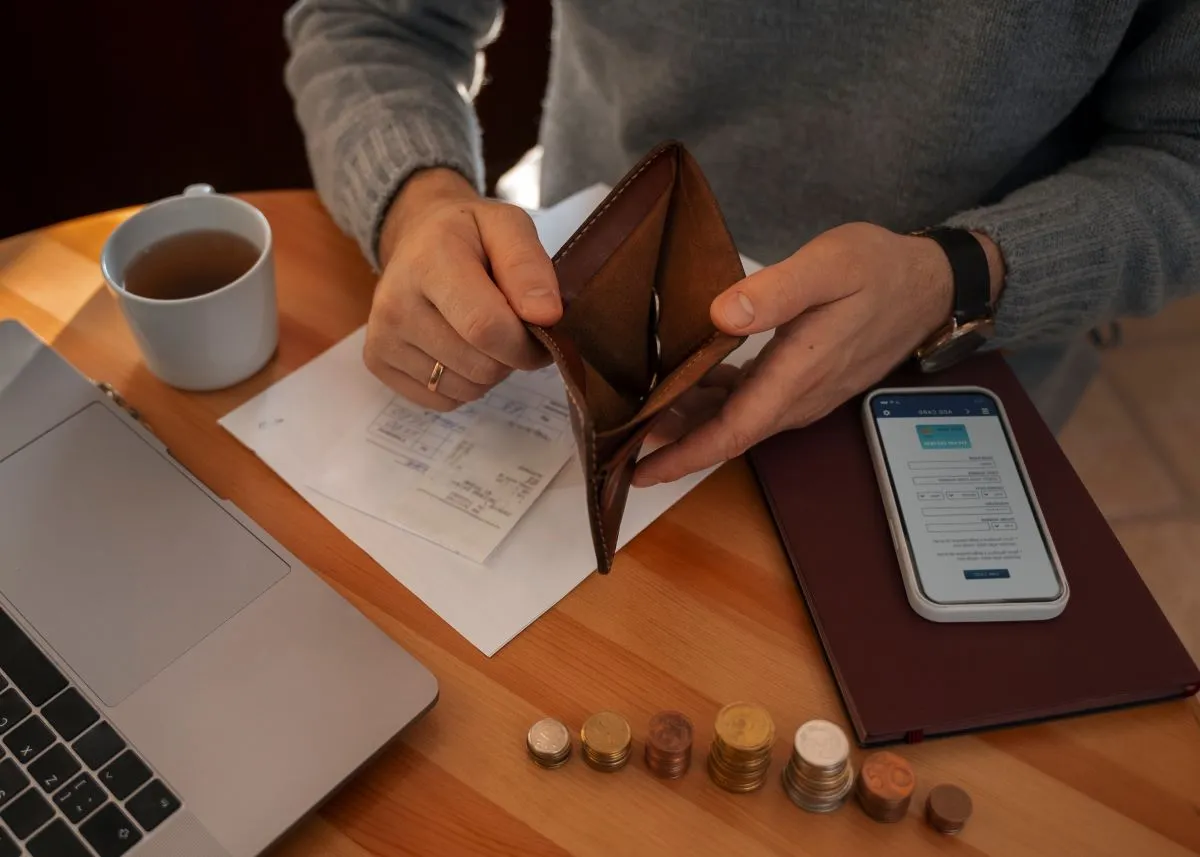 man saving money energy crisis