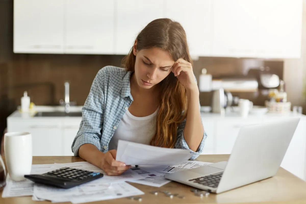 young woman checking her budget doing taxes